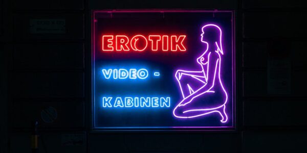 neon sign of erotik video kabinen at night